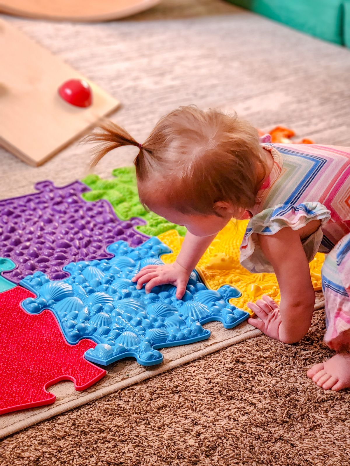a preschool kid of age 4 to 6 year old playing on muffik sensory play mats from tinnitots australia