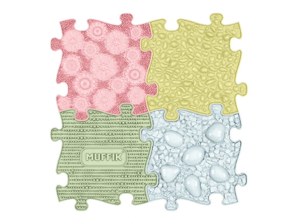 Four puzzle piece mats with different textures and patterns on a white background