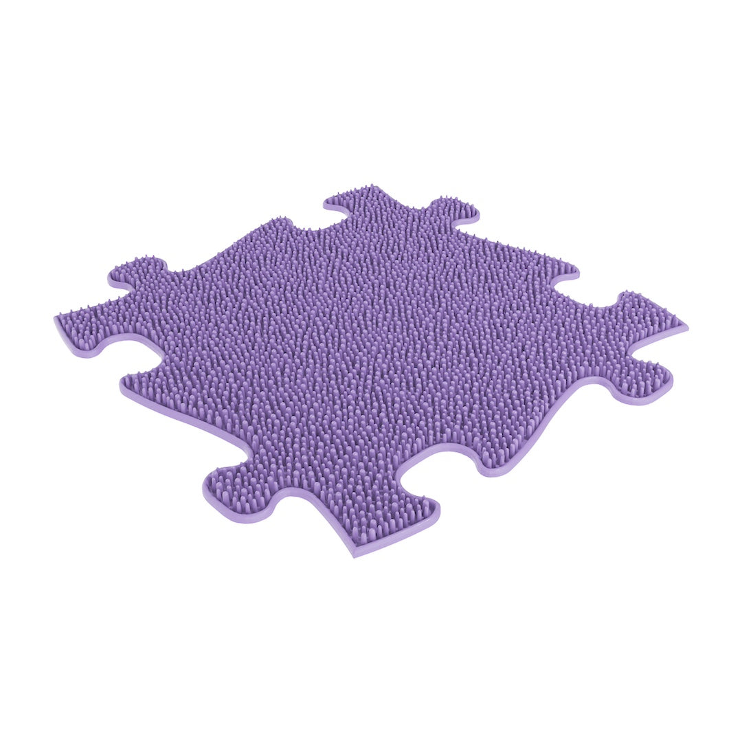 A purple sensory playmat designed in puzzle piece shape, intended for children's activities.