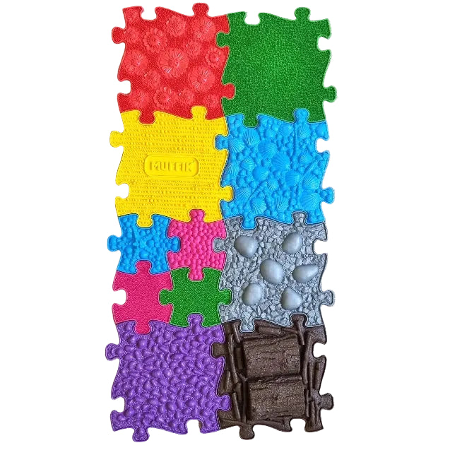 A collection of colorful, textured playmat pieces arranged on the floor to form a larger mat. The pieces have various textures and colors, including red, blue, green, yellow, purple, and brown, resembling different surfaces such as grass, stones, and logs.