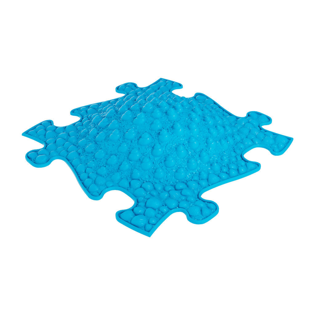 A blue, puzzle-piece shaped sensory playmat designed for children's motor skill development and sensory experiences.