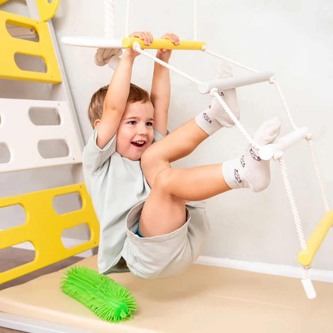 Boy on a Pikler Play Gym TINNITOTS