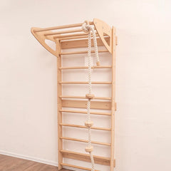 Wooden climbing ladder with rope on a white wall