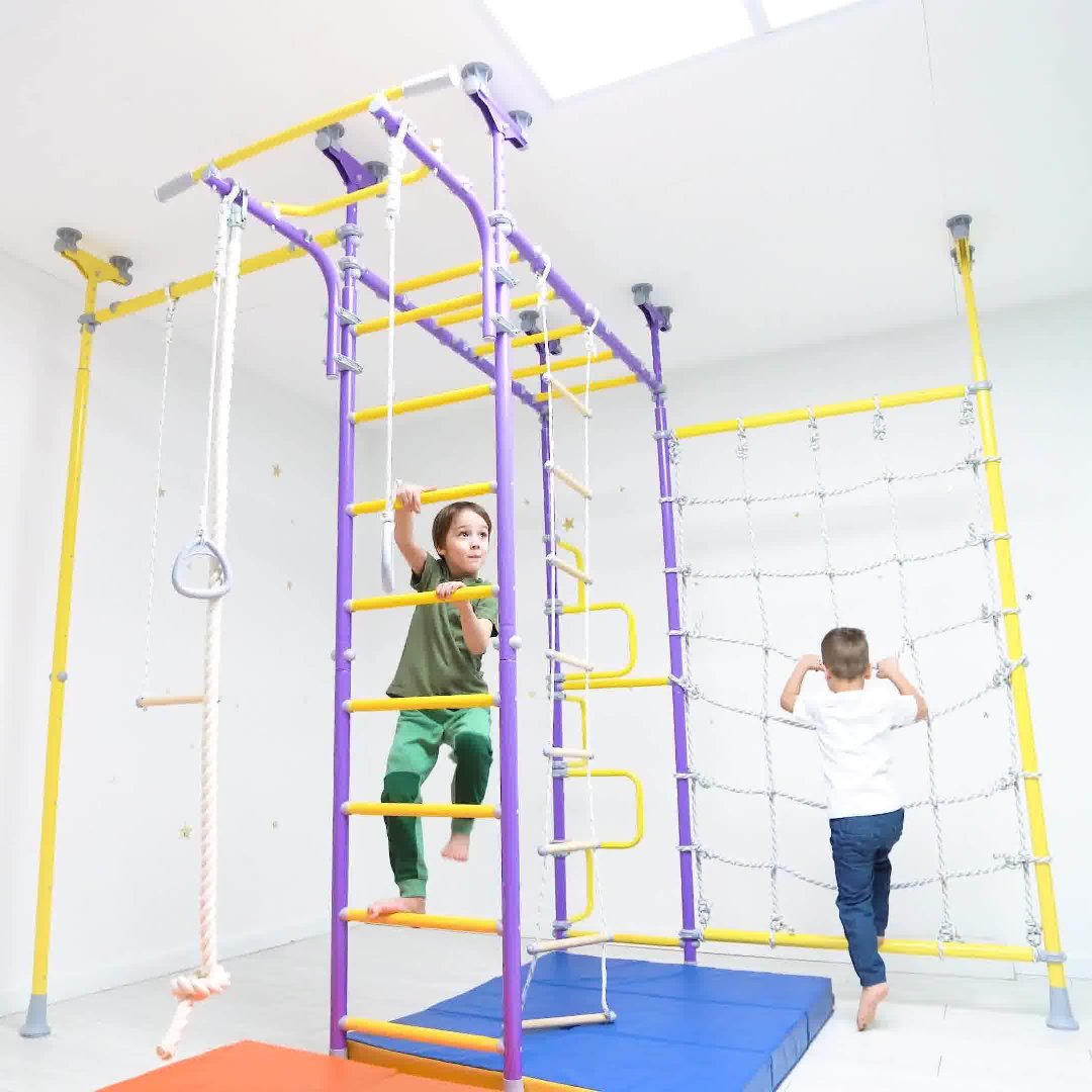 kids playing on monkey bars with sensory swings by Tinnitots