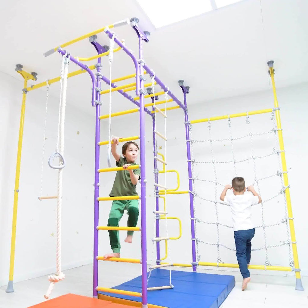 kids playing on monkey bars with sensory swings by Tinnitots