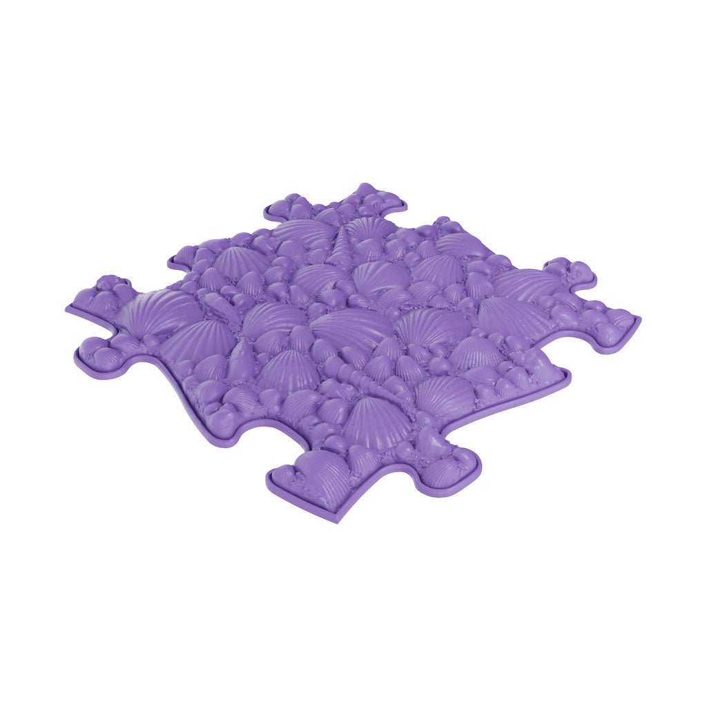 A purple sensory playmat with a seashell pattern, designed to be used on the floor for children's activities.