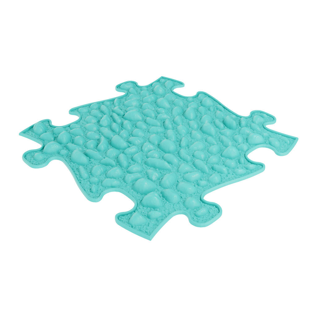 Turquoise coloured floor tile in puzzle shape