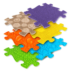 Colorful bright puzzle Muffik sensory playmats with various shades and shapes, symbolizing diversity and uniqueness.